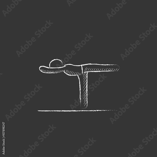 Man practicing yoga. Drawn in chalk icon.