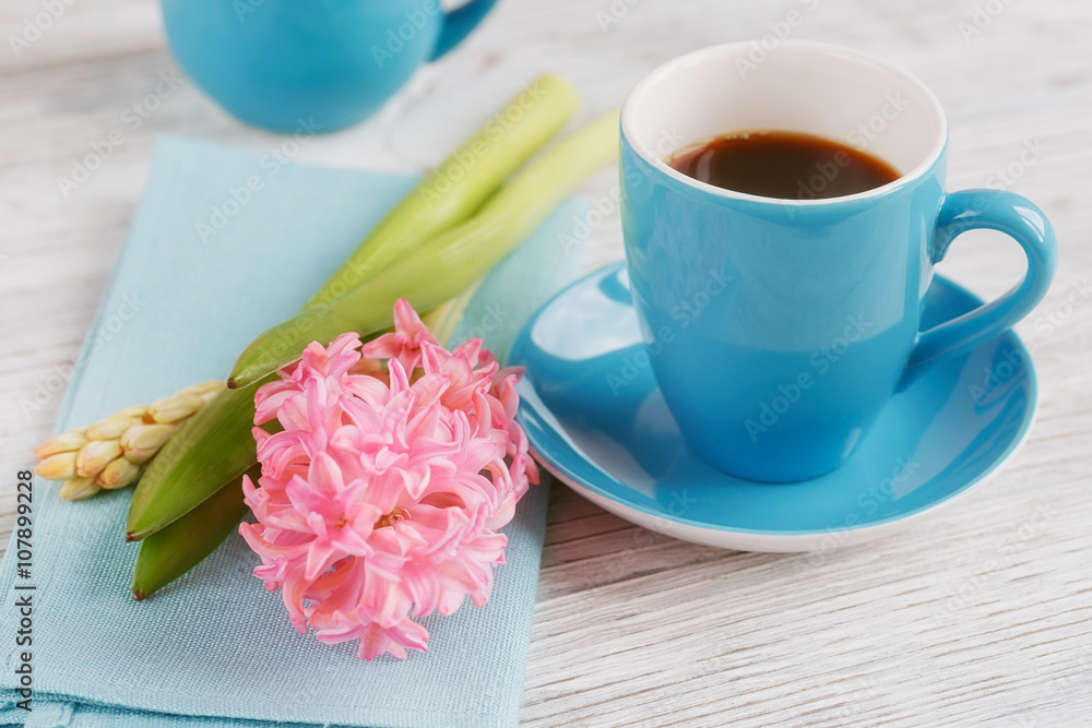 Cup of black coffee and pink flower Cup of black coffee and pink flower