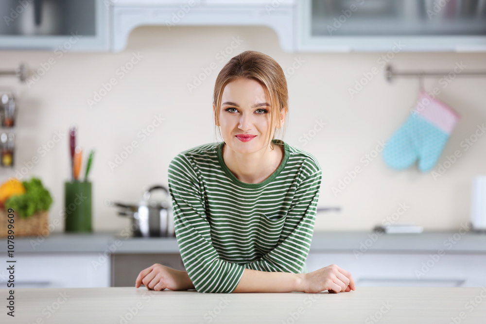 Young woman in the kitchen Young woman in the kitchen