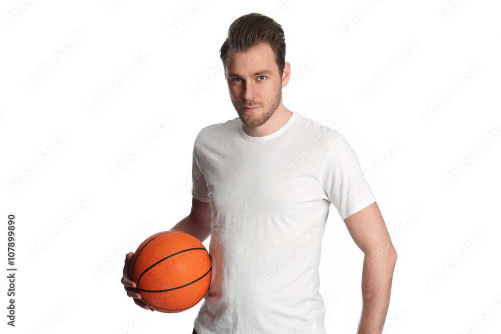 Obraz premium Focused basketball player wearing a white tshirt and holding a basketball. Standing against a white background staring at camera.