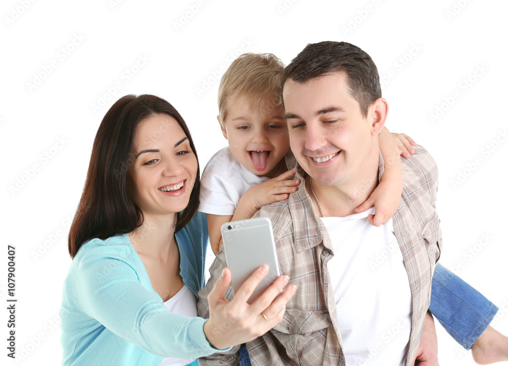 Happy family making selfie with mobile phone isolated on white Happy family making selfie with mobile phone isolated on white