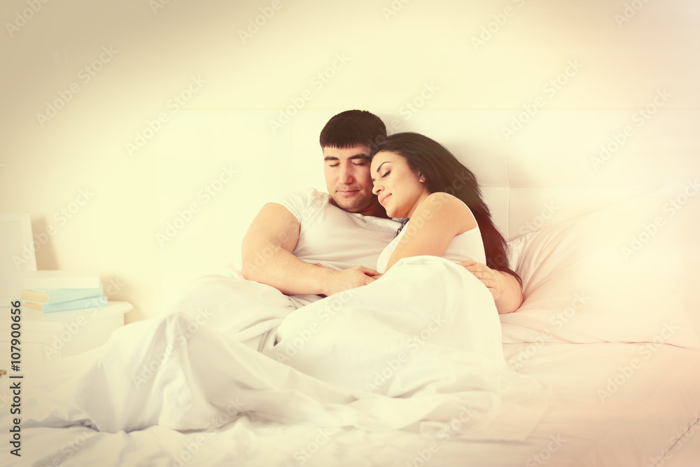 Lovely couple sleeping in white bed Lovely couple sleeping in white bed