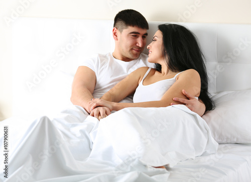 Lovely couple in white bed