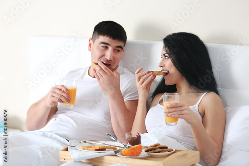 Lovely couple having breakf...