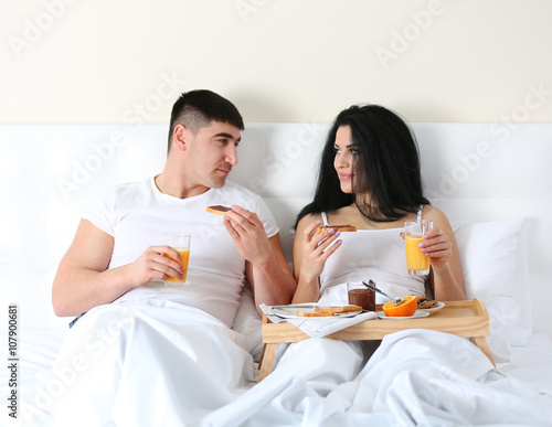 Lovely couple having breakf...
