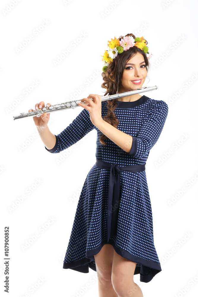 Beautiful young woman with flute isolated on white Beautiful young woman with flute isolated on white