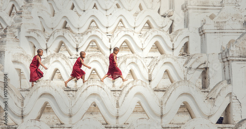 Buddhist novice are walking in temple, Myanmar