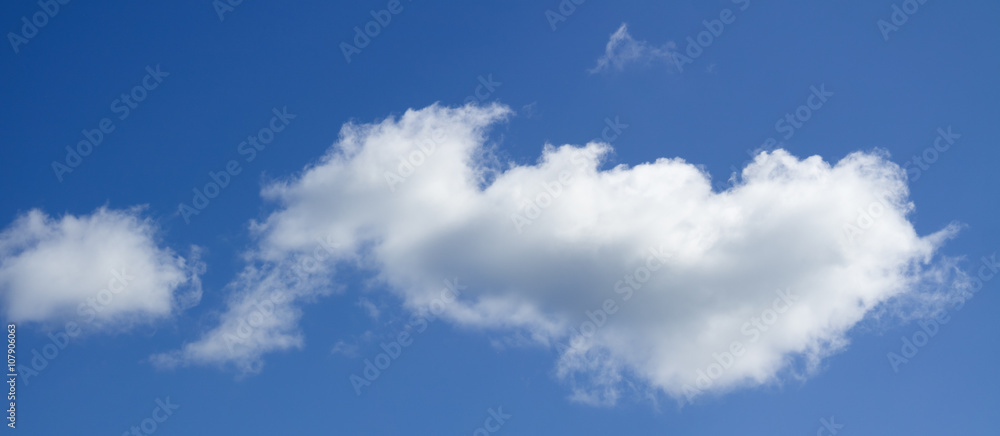 Big white heap clouds against a blue sky. Big white heap clouds against a blue sky.