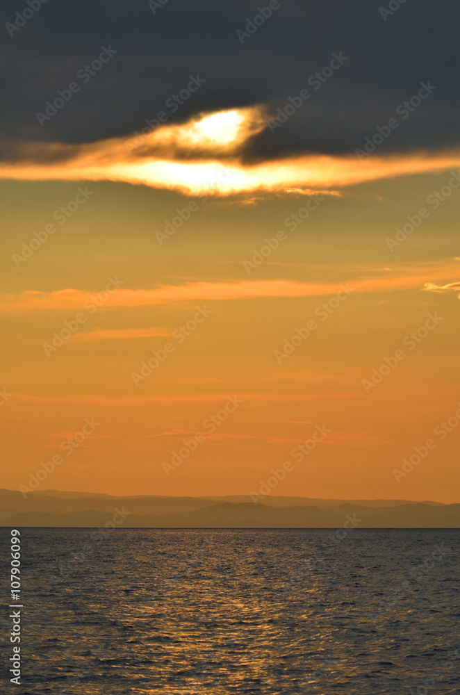 Beautiful maroon sunset on lake Baikal.