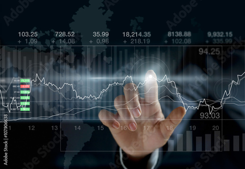 Business person touching charts and diagrams stock market  photo
