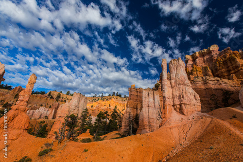 Bryce Canyon scenery, profiled on deep blue sky with clouds