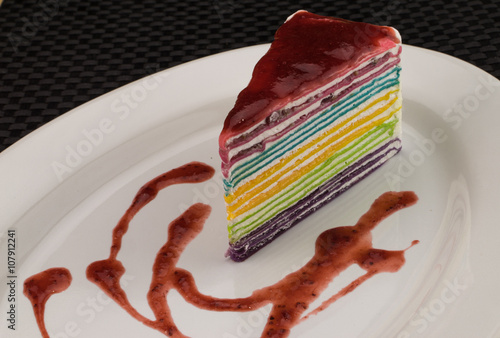 rainbow crepecake with strawberry syrup photo