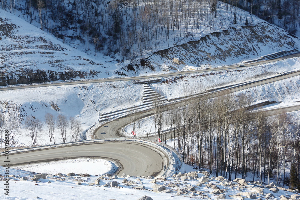 Mountain  highway among snow slope , Belokurikha,  Altai, Russia
