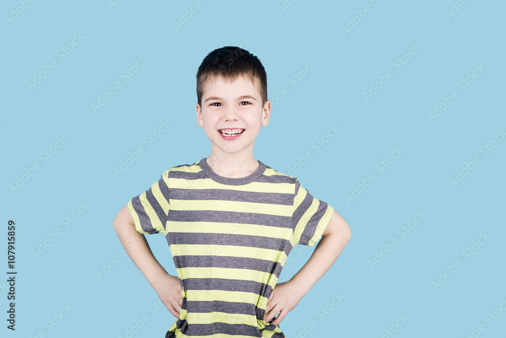 teenager boy smiling. child looking into camera on blue background, isolated teenager boy smiling. child looking into camera on blue background, isolated