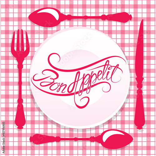 Bon appetit! Calligraphic text on plate with fork, knife and spo