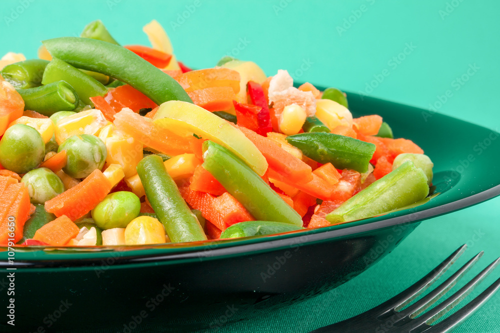 raw vegetable mix on the yellow plate