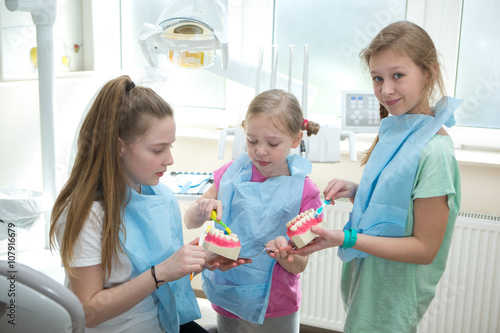 girls learning about dental hygiene. Dental hygiene 