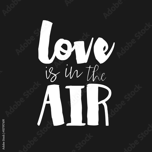 Love is in the air - hand drawn inspirational quote. Hand lettering, typographic element for your design. Vector element for housewarming poster, t-shirt design. Handdrawn lettering.
