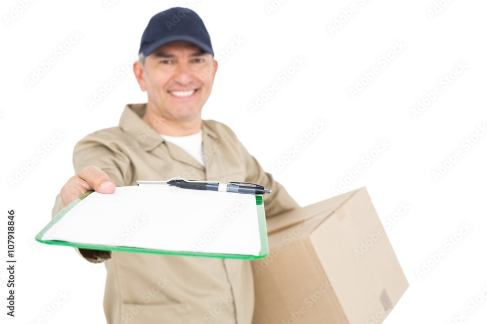 Delivery man with package giving clipboard for signature Delivery man with package giving clipboard for signature