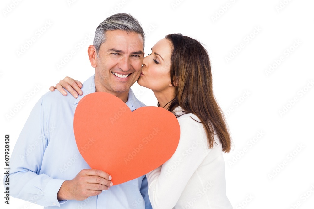 Lovely couple holding big heart