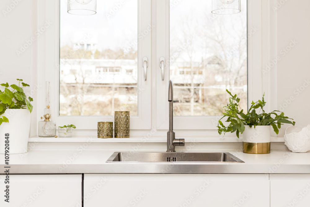 detail of a fancy kitchen sink by the window detail of a fancy kitchen sink by the window