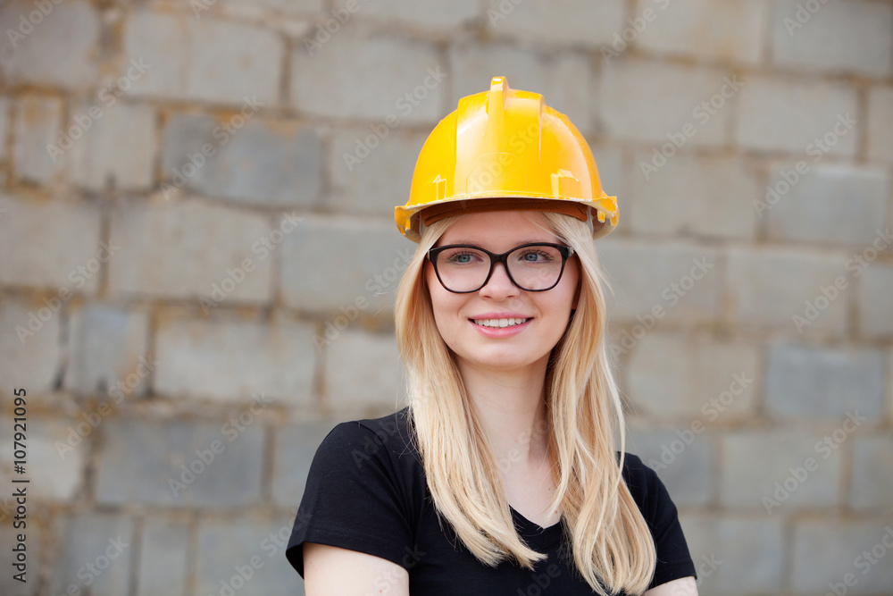 Young architect with yellow helmet Young architect with yellow helmet