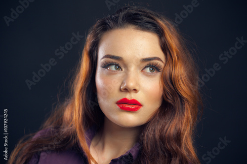 Portrait of beutiful girl isolated on dark background