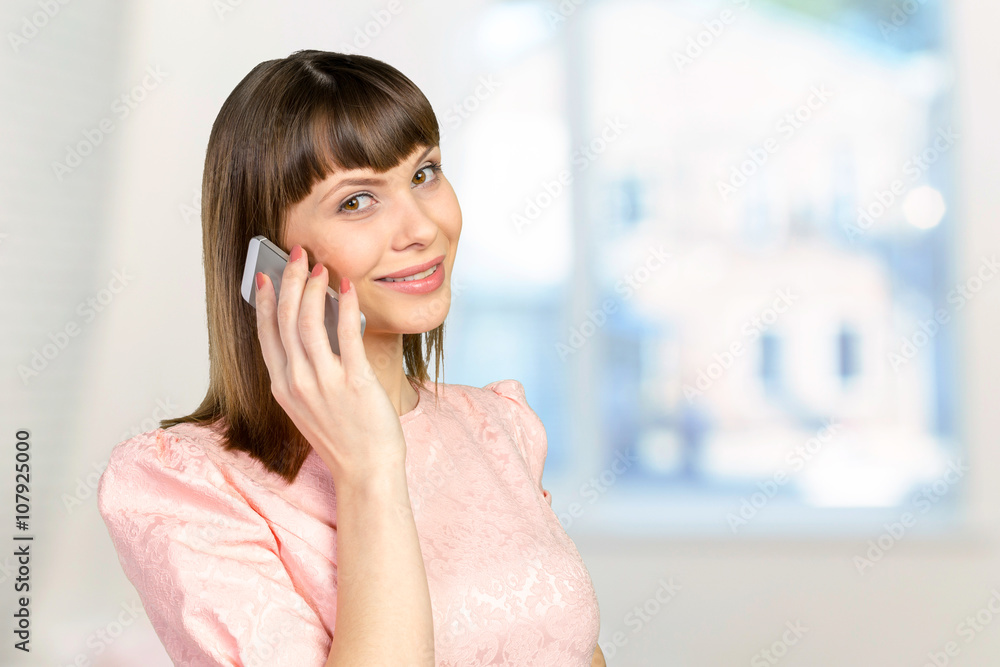 Happy businesswoman using smartphone