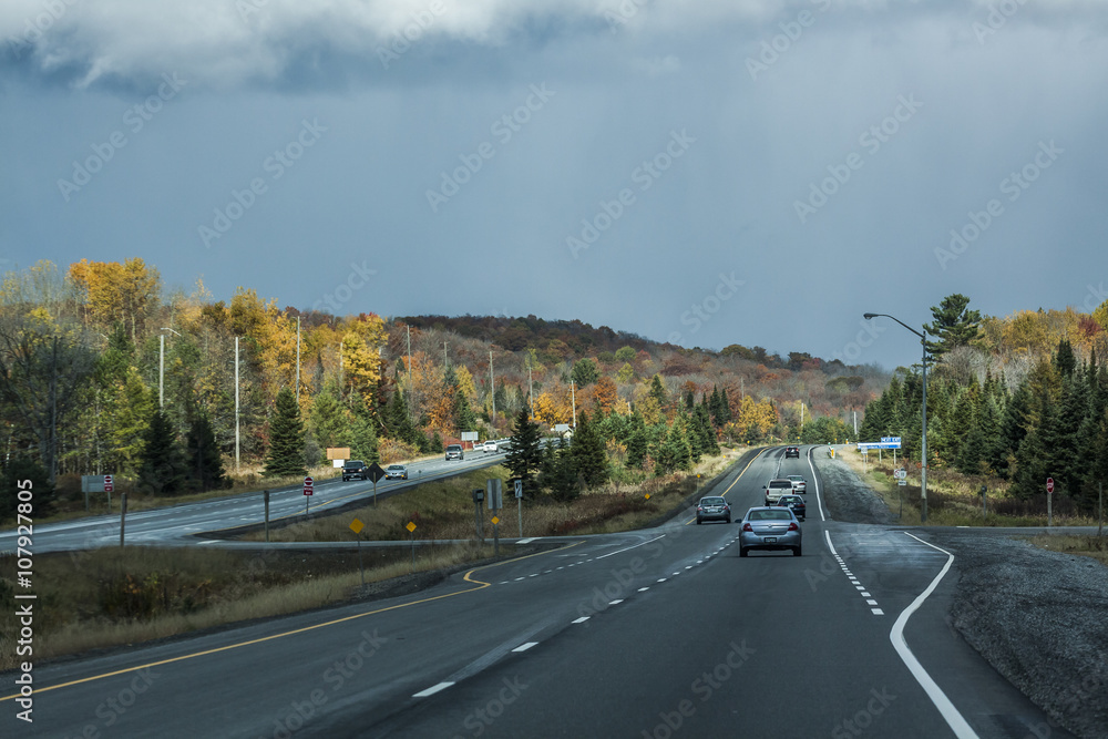 the view down a scenic country roadway in autumn landscape the view down a scenic country roadway in autumn landscape