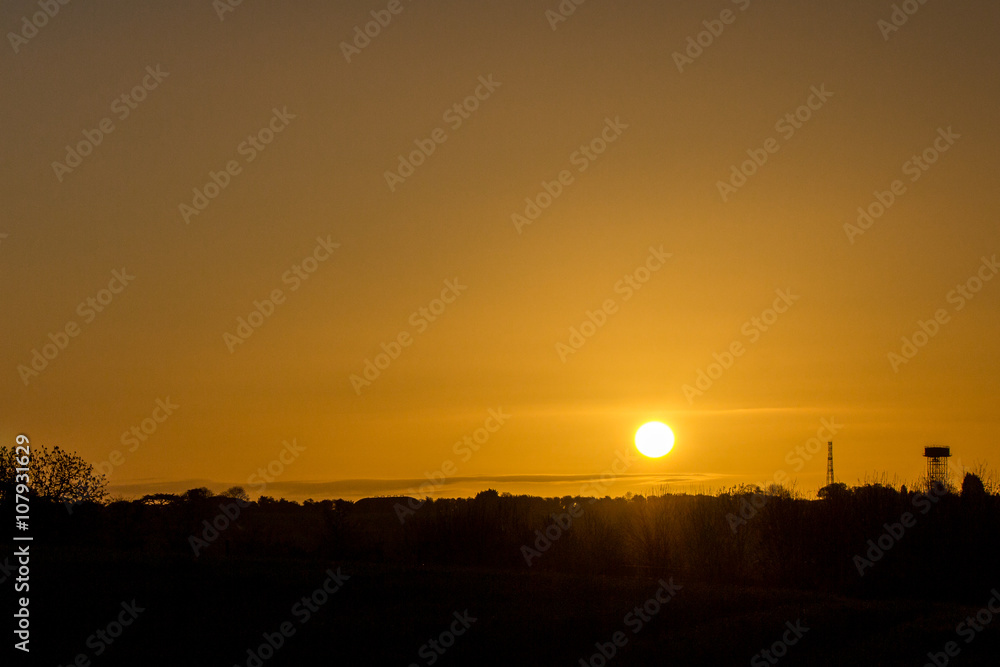 Fototapeta premium Sunrise over a water tower