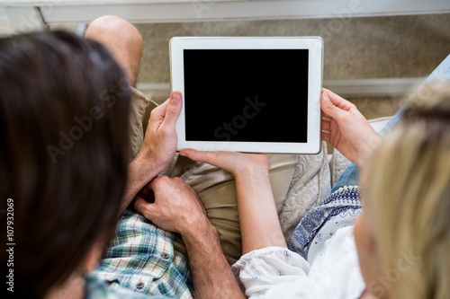 High angle view of couple with digital tablet