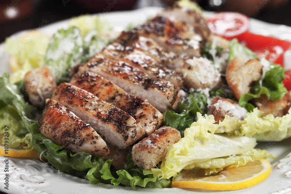 Spicy grilled chicken with caesar salad