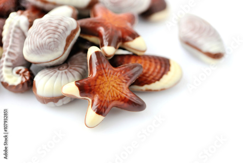 Swiss chocolate seashells on white background