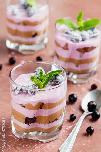 Black currant and chocolate dessert in glass