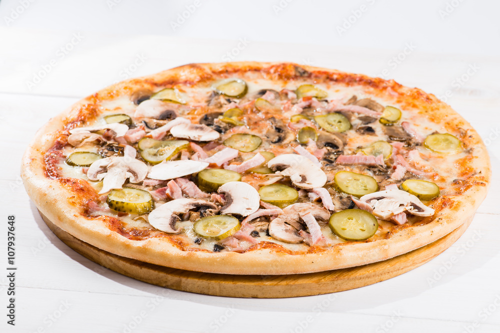 tasty pizza on a white wooden background