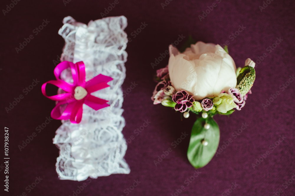 bouquet of flowers with bandage bride lying on purple backgrou bouquet of flowers with bandage bride lying on purple backgrou