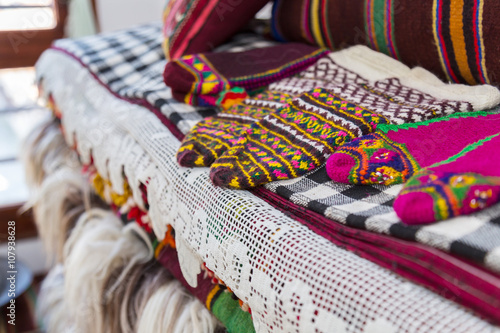 Bulgarian traditional hand-knitted slippers (socks), woolen blankets and rugs, Rhodope Mountains, Bulgaria