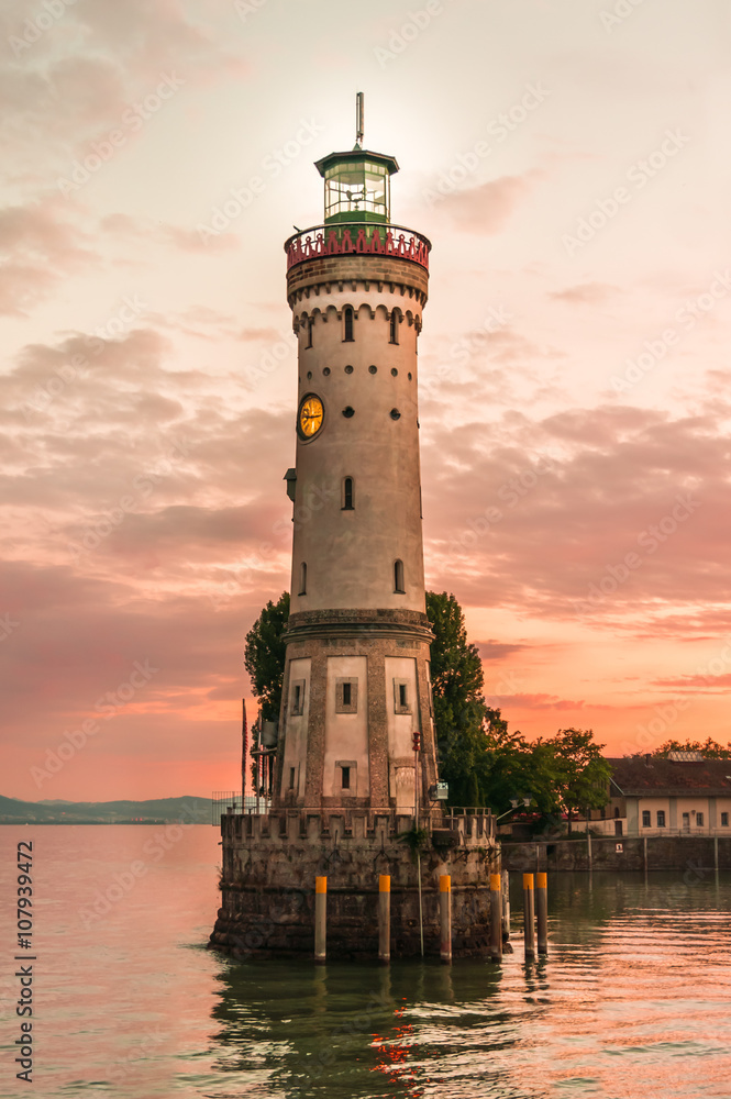 Lighthouse and sunset in harbor of Lindau in lake Constance