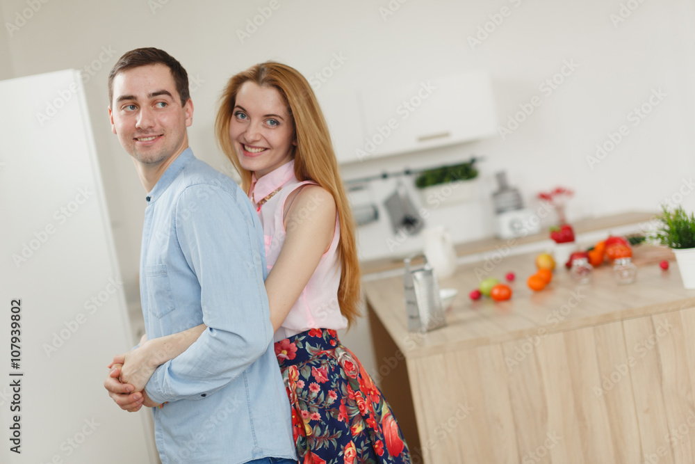 man and woman in the kitchen. man and woman in the kitchen.