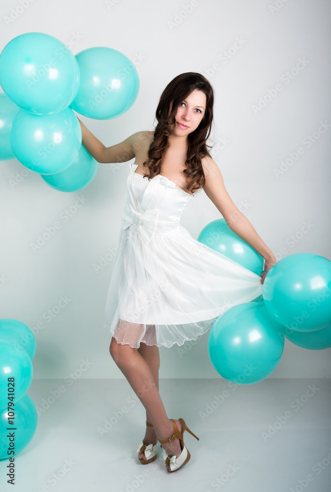 beautiful curly girl in a white dress and sunglasses in the style of disco playing with balloons beautiful curly girl in a white dress and sunglasses in the style of disco playing with balloons