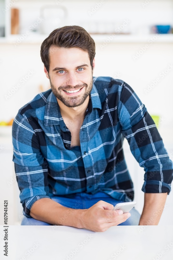 Man holding mobile phone Man holding mobile phone
