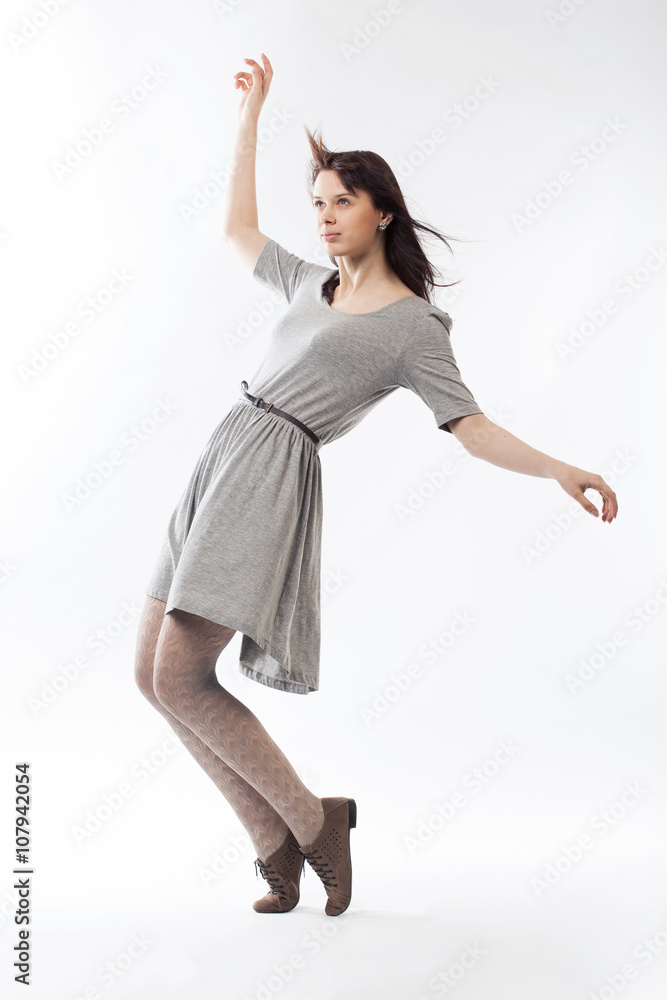 Obraz premium beautiful girl in motion on white backround