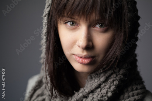 beautiful girl with knitted scarf portrait