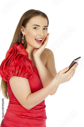 Beautiful woman writes a message on the phone