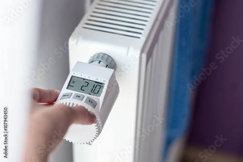 Quadro su tela Woman's hand adjusting temperature