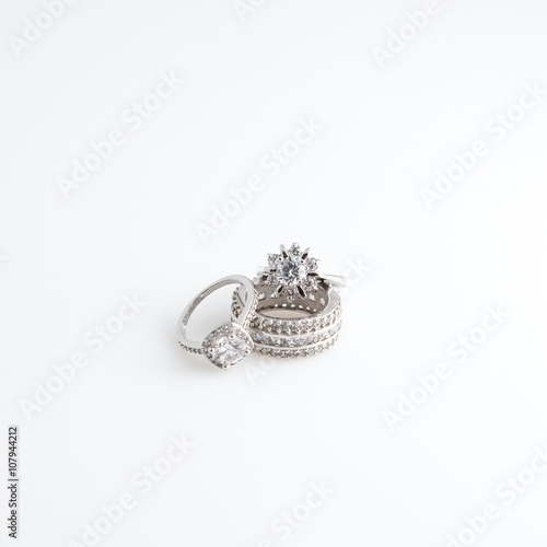 Luxury jewelry. White gold or silver rings with diamonds. Selective focus