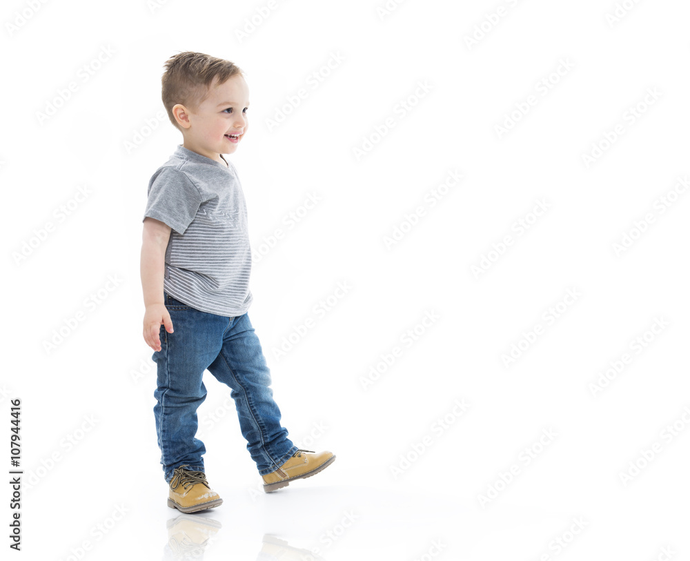three years boy eating and walking isolated on white three years boy eating and walking isolated on white