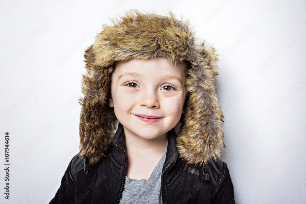 child in fur Hat fashion casual winter style little boy child in fur Hat fashion casual winter style little boy