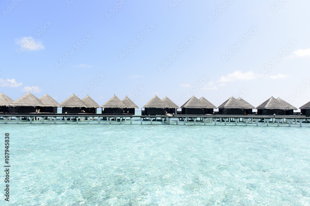 Over water bungalows with steps into amazing green lagoon