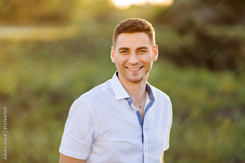 Portrait of Handsome Man against green nature background Portrait of Handsome Man against green nature background